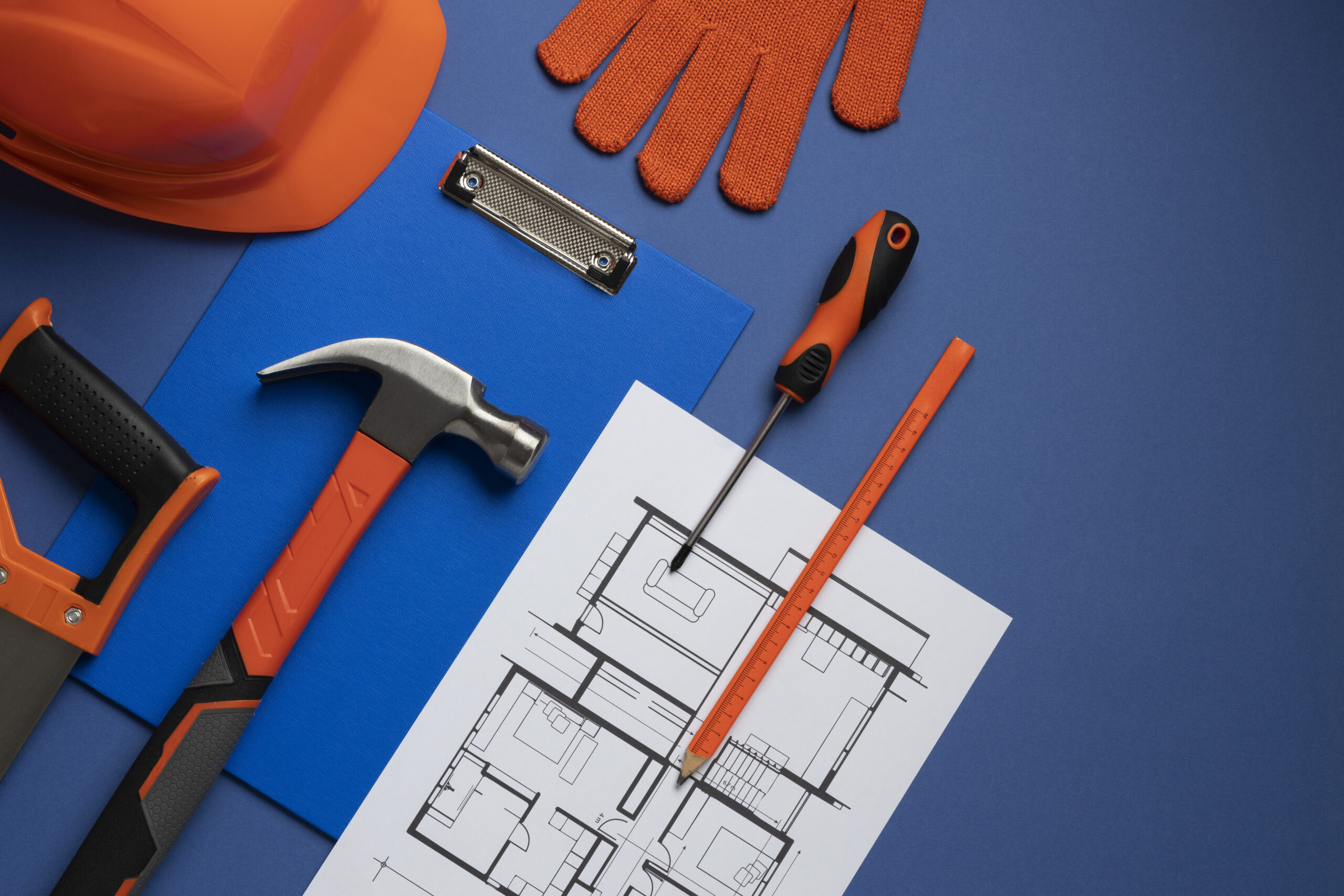 top view steel hammer with other construction elements tools 1 scaled